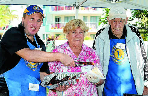 Lions volunteers Nathan Glarvey, Margarite Costa and Ian Granger served up the sausages at the volunteers’ day at Cotton Tree.